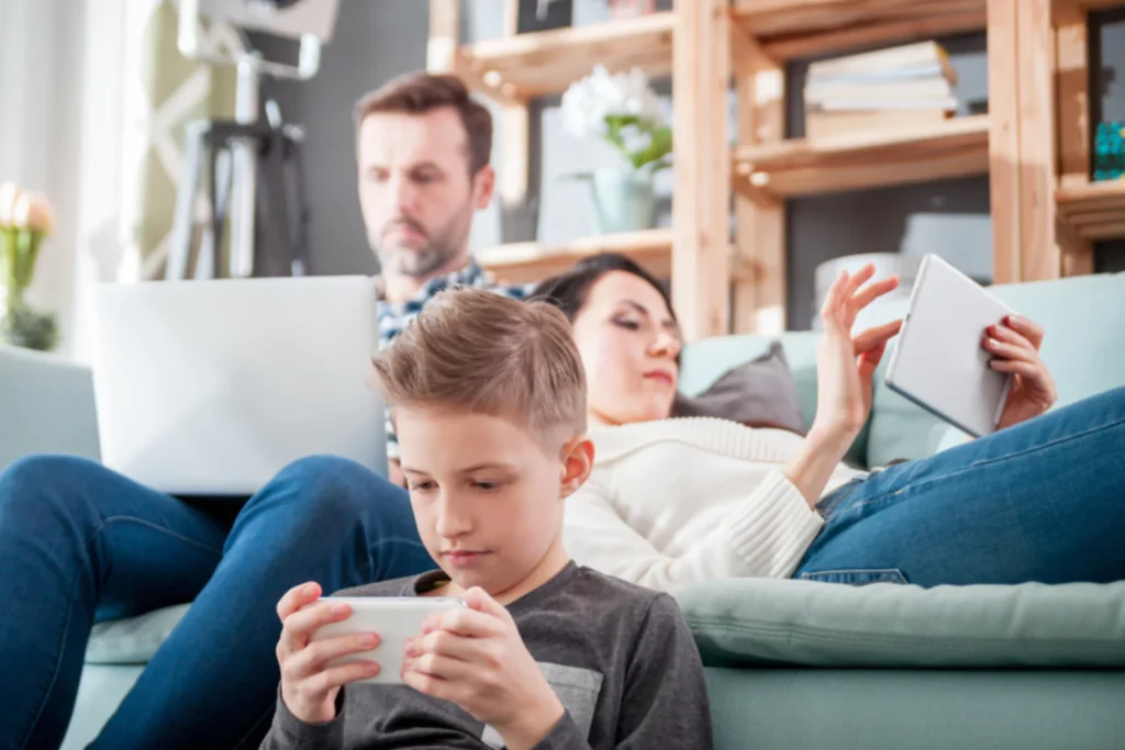 A family sitting on a couch