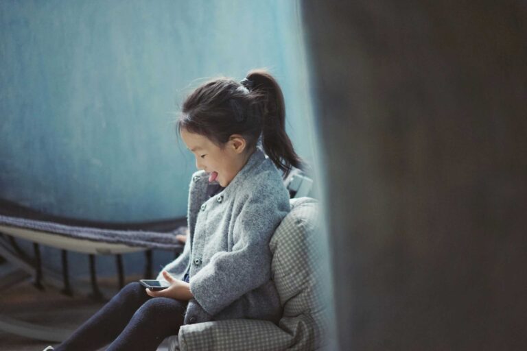 girl looking at cell
